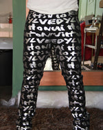 Cargar imagen en el visor de la galería, PANTALÓN EXÓTICO NEGRO CON LETRAS PLATEADAS
